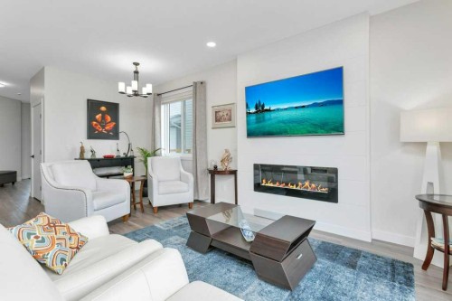 26 Athens Place, Blackfalds, AB - Indoor Photo Showing Living Room With Fireplace