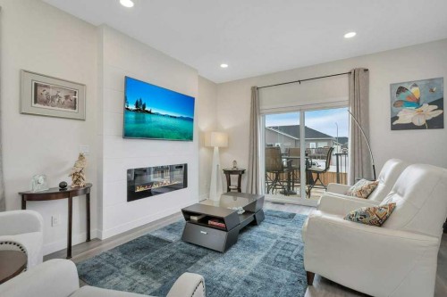 26 Athens Place, Blackfalds, AB - Indoor Photo Showing Living Room With Fireplace