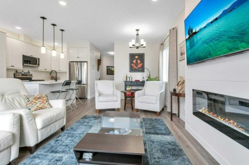 26 Athens Place, Blackfalds, AB - Indoor Photo Showing Living Room With Fireplace