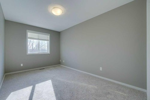 7-5301 Windward Place, Sylvan Lake, AB - Indoor Photo Showing Other Room