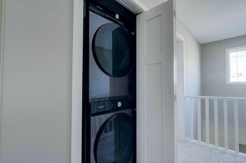 7-5301 Windward Place, Sylvan Lake, AB - Indoor Photo Showing Laundry Room