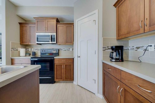 7-5301 Windward Place, Sylvan Lake, AB - Indoor Photo Showing Kitchen
