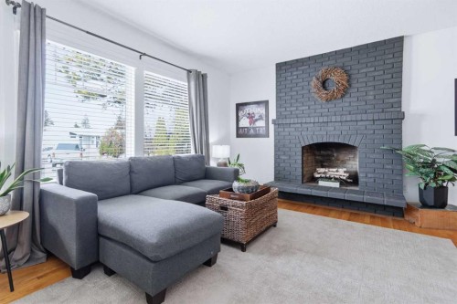 13 Ockley Close, Red Deer, AB - Indoor Photo Showing Living Room With Fireplace