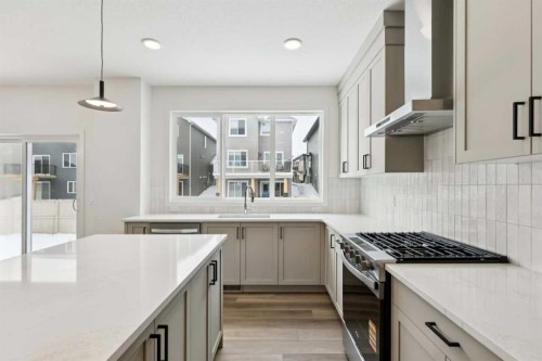 823 Bayview Terrace Sw, Airdrie, AB - Indoor Photo Showing Kitchen With Upgraded Kitchen