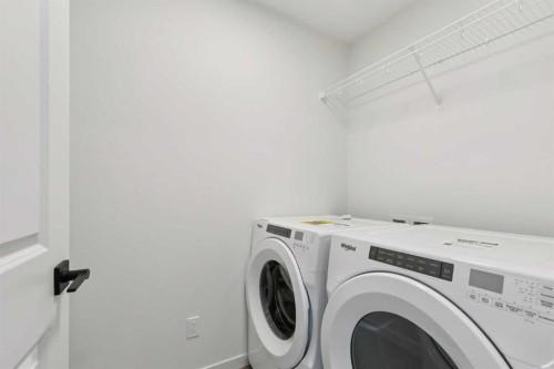 823 Bayview Terrace Sw, Airdrie, AB - Indoor Photo Showing Laundry Room