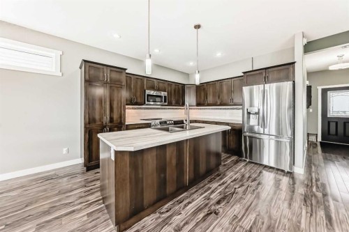 3 Hanson Green, Penhold, AB - Indoor Photo Showing Kitchen With Double Sink With Upgraded Kitchen
