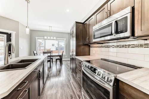 3 Hanson Green, Penhold, AB - Indoor Photo Showing Kitchen With Double Sink With Upgraded Kitchen
