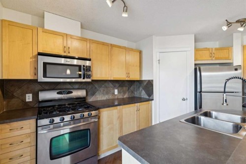 99 Auburn Bay Manor Se, Calgary, AB - Indoor Photo Showing Kitchen With Stainless Steel Kitchen With Double Sink