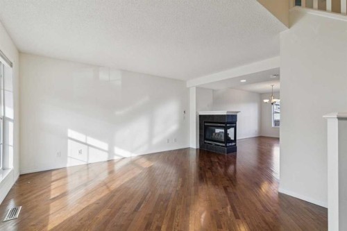 99 Auburn Bay Manor Se, Calgary, AB - Indoor Photo Showing Living Room With Fireplace