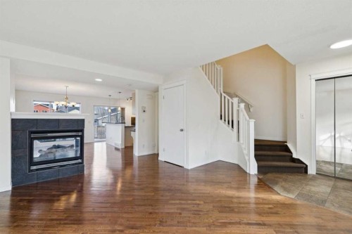 99 Auburn Bay Manor Se, Calgary, AB - Indoor Photo Showing Living Room With Fireplace