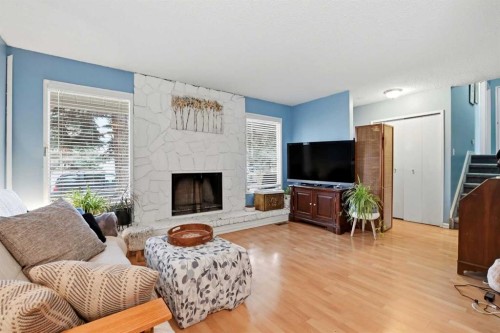 39 Norris Close, Red Deer, AB - Indoor Photo Showing Living Room With Fireplace