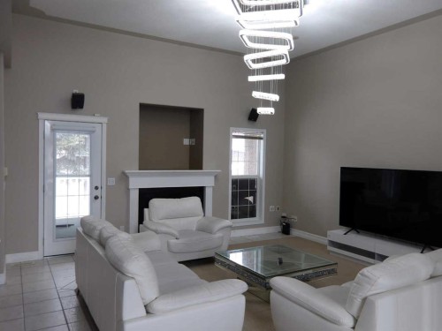 39 Ashley Close, Red Deer, AB - Indoor Photo Showing Living Room With Fireplace