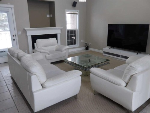 39 Ashley Close, Red Deer, AB - Indoor Photo Showing Living Room With Fireplace