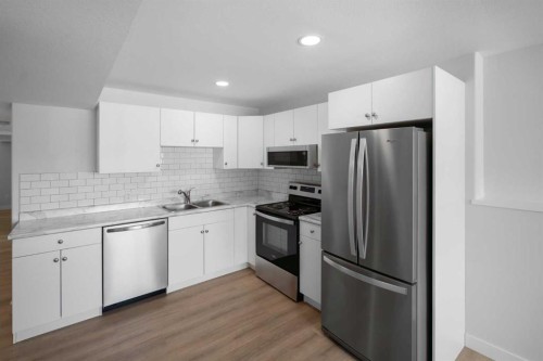 7403 44 Avenue, Camrose, AB - Indoor Photo Showing Kitchen With Double Sink With Upgraded Kitchen