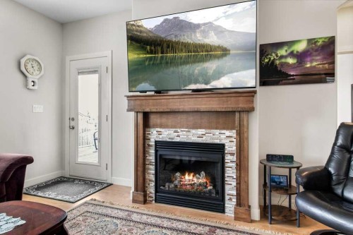 4916 Beardsley Avenue, Lacombe, AB - Indoor Photo Showing Living Room With Fireplace