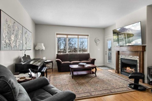 4916 Beardsley Avenue, Lacombe, AB - Indoor Photo Showing Living Room With Fireplace