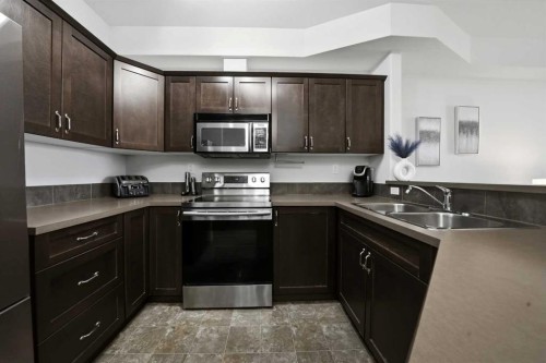 315-69 Ironstone, Red Deer, AB - Indoor Photo Showing Kitchen With Double Sink