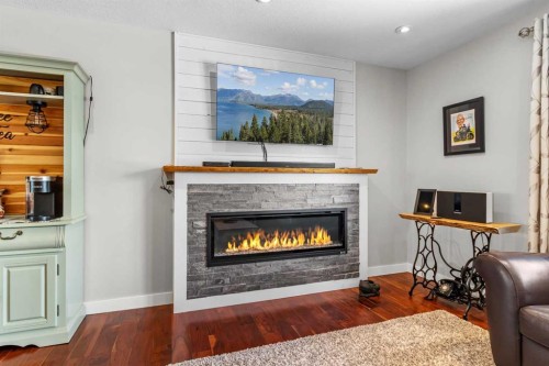 37 Northstar Drive, Lacombe, AB - Indoor Photo Showing Living Room With Fireplace