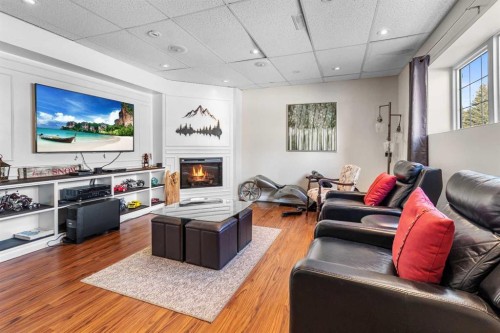 37 Northstar Drive, Lacombe, AB - Indoor Photo Showing Living Room With Fireplace