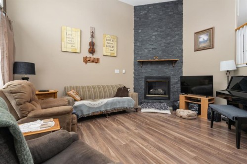132 Edgewood Close, Camrose, AB - Indoor Photo Showing Living Room With Fireplace