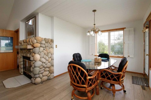 37466 Range Road 263, Rural Red Deer County, AB - Indoor Photo Showing Dining Room With Fireplace
