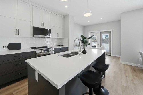 114 Palmer Circle, Blackfalds, AB - Indoor Photo Showing Kitchen With Double Sink With Upgraded Kitchen