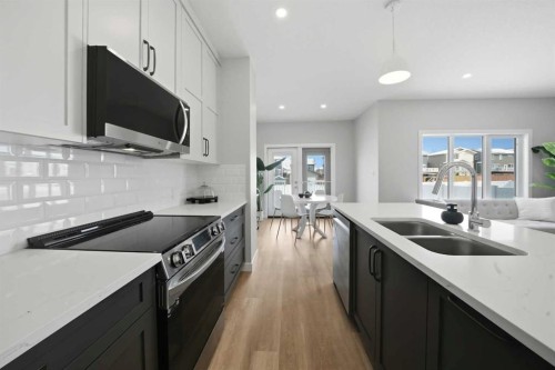 114 Palmer Circle, Blackfalds, AB - Indoor Photo Showing Kitchen With Double Sink With Upgraded Kitchen