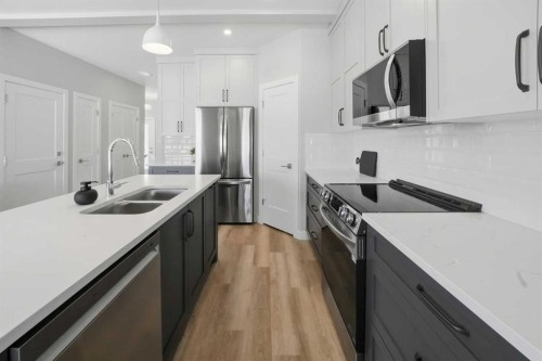 114 Palmer Circle, Blackfalds, AB - Indoor Photo Showing Kitchen With Double Sink With Upgraded Kitchen