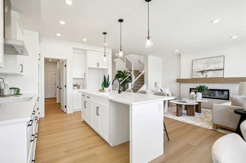 98 Creekstone Place Sw, Calgary, AB - Indoor Photo Showing Kitchen With Fireplace With Upgraded Kitchen