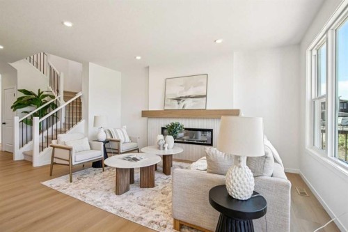 98 Creekstone Place Sw, Calgary, AB - Indoor Photo Showing Living Room With Fireplace