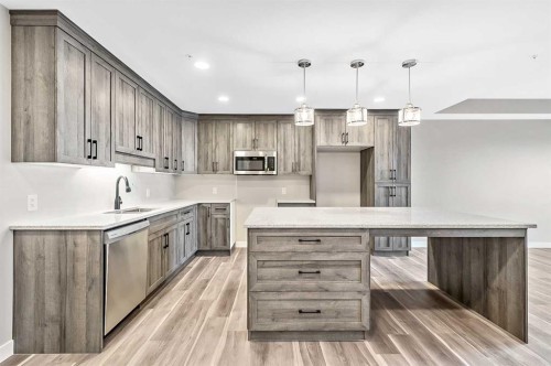 405-97 Station Drive, Sylvan Lake, AB - Indoor Photo Showing Kitchen With Upgraded Kitchen