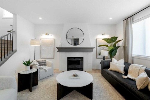 236 Amblestone Crescent Nw, Calgary, AB - Indoor Photo Showing Living Room With Fireplace