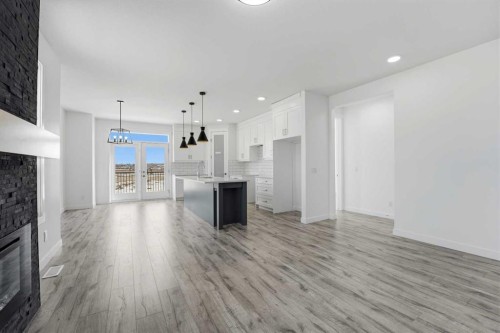 4240 Bauman Way, Innisfail, AB - Indoor Photo Showing Other Room With Fireplace