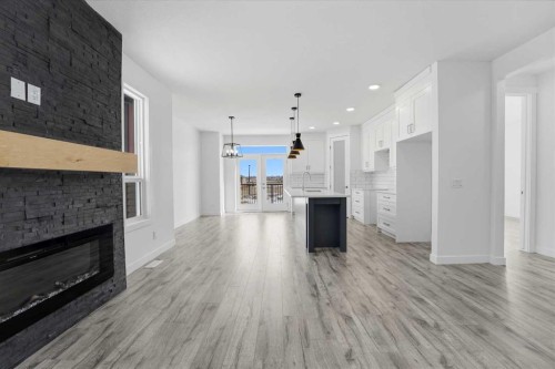 4240 Bauman Way, Innisfail, AB - Indoor Photo Showing Living Room With Fireplace