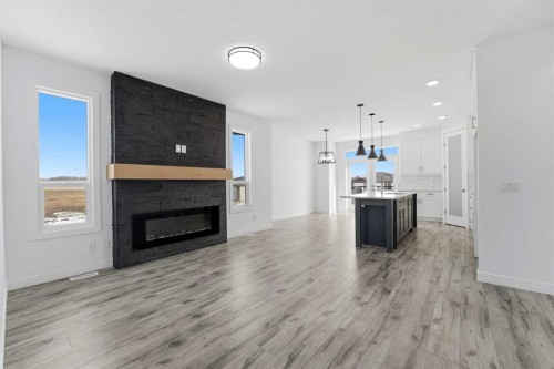 4240 Bauman Way, Innisfail, AB - Indoor Photo Showing Living Room With Fireplace