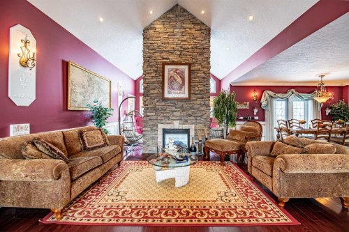 295 Jarvis Glen Close, Jarvis Bay, AB - Indoor Photo Showing Living Room With Fireplace