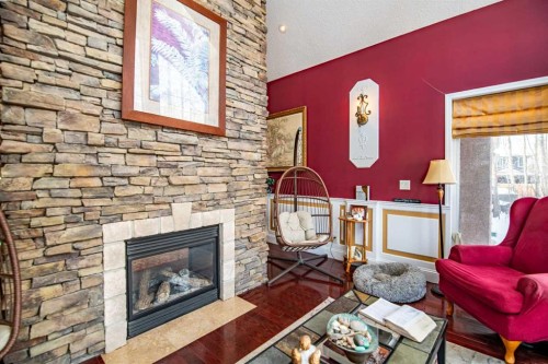 295 Jarvis Glen Close, Jarvis Bay, AB - Indoor Photo Showing Living Room With Fireplace
