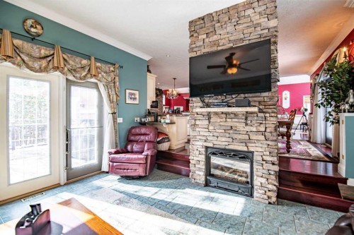 295 Jarvis Glen Close, Jarvis Bay, AB - Indoor Photo Showing Other Room With Fireplace