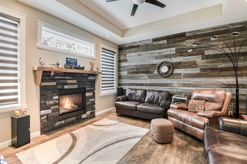 18 Mackenzie Crescent, Lacombe, AB - Indoor Photo Showing Living Room With Fireplace