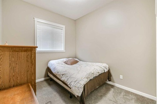 18 Mackenzie Crescent, Lacombe, AB - Indoor Photo Showing Bedroom