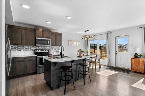 157 Hampton Crescent, Sylvan Lake, AB - Indoor Photo Showing Kitchen With Double Sink With Upgraded Kitchen