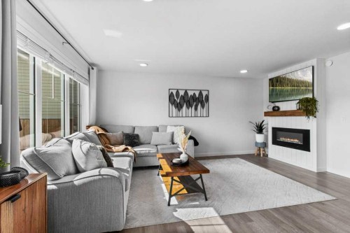 157 Hampton Crescent, Sylvan Lake, AB - Indoor Photo Showing Living Room With Fireplace