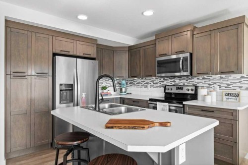 157 Hampton Crescent, Sylvan Lake, AB - Indoor Photo Showing Kitchen With Double Sink With Upgraded Kitchen