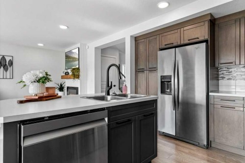 157 Hampton Crescent, Sylvan Lake, AB - Indoor Photo Showing Kitchen With Double Sink