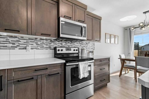 157 Hampton Crescent, Sylvan Lake, AB - Indoor Photo Showing Kitchen With Upgraded Kitchen