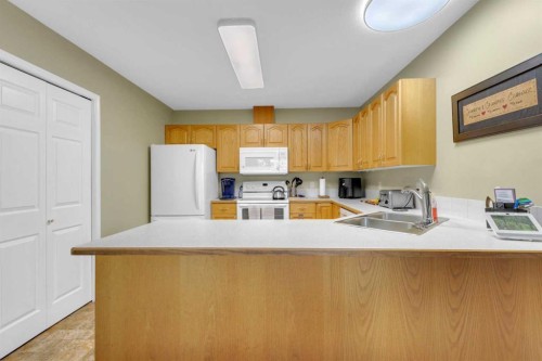 B-3621 51 Avenue, Red Deer, AB - Indoor Photo Showing Kitchen With Double Sink