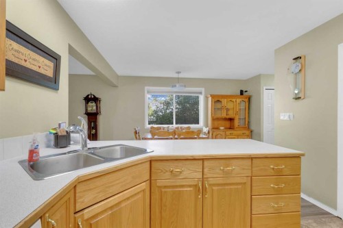 B-3621 51 Avenue, Red Deer, AB - Indoor Photo Showing Kitchen With Double Sink