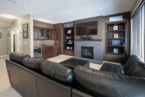 146 Sutherland Close, Red Deer, AB - Indoor Photo Showing Living Room With Fireplace