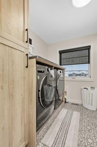 52 Iron Gate Boulevard, Sylvan Lake, AB - Indoor Photo Showing Laundry Room
