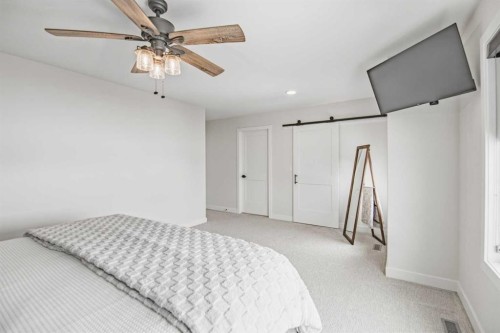 52 Iron Gate Boulevard, Sylvan Lake, AB - Indoor Photo Showing Bedroom